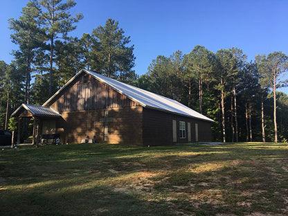 The lodge--plenty of space inside for sewing and eating. Has a large fireplace and a stage.